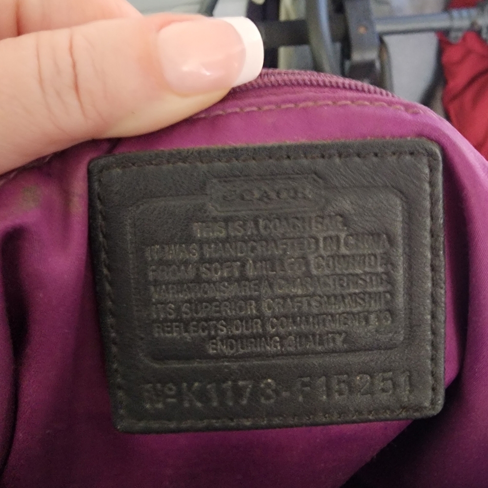 Vintage Coach pebble leather w/ chain embellishments and hot purple interior.